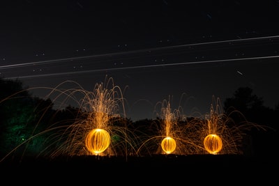steel wool photography of orange lights
